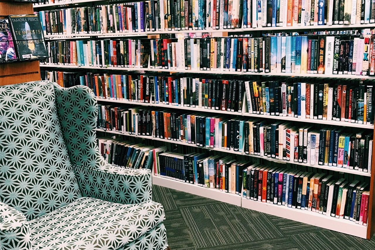 pomeroy library fiction stacks with chair